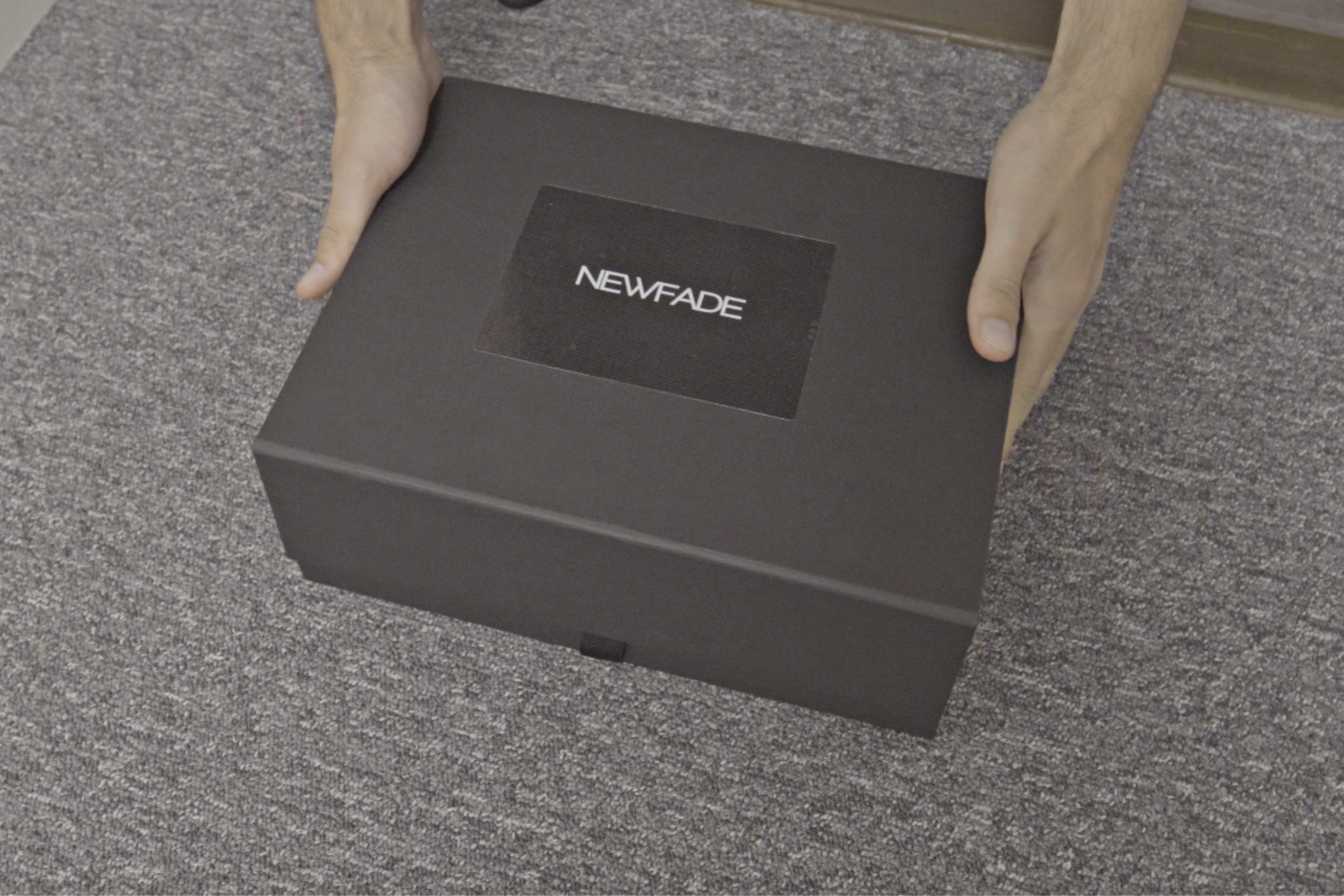 Person holding box containing new fade product